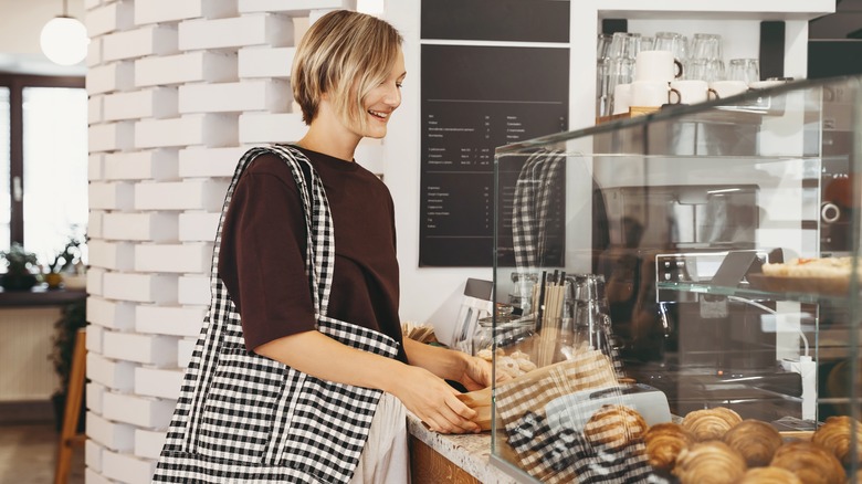 A customer picking up an order at a bakery