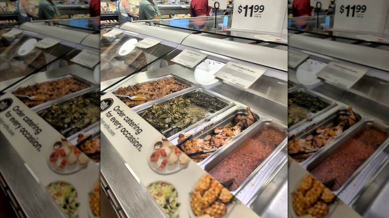 Whole Foods hot bar display with beans, chicken, and greens