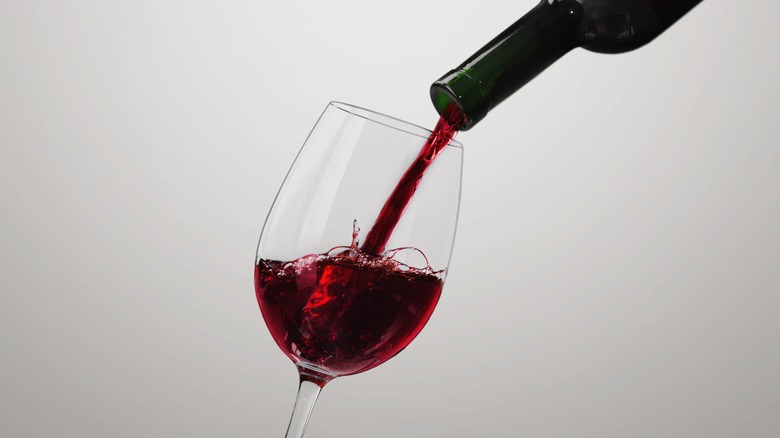 Red wine being poured into a glass