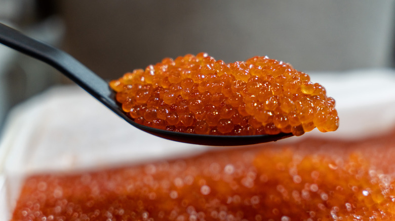 A spoonful of red caviar