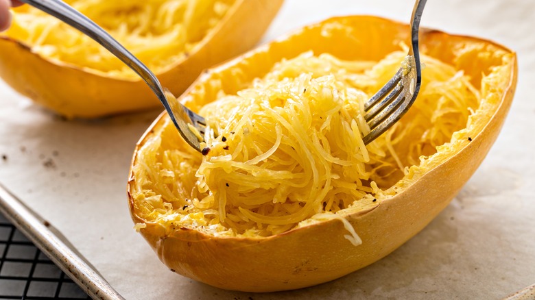 Close-up of spaghetti squash that's been broken into strings by two forks