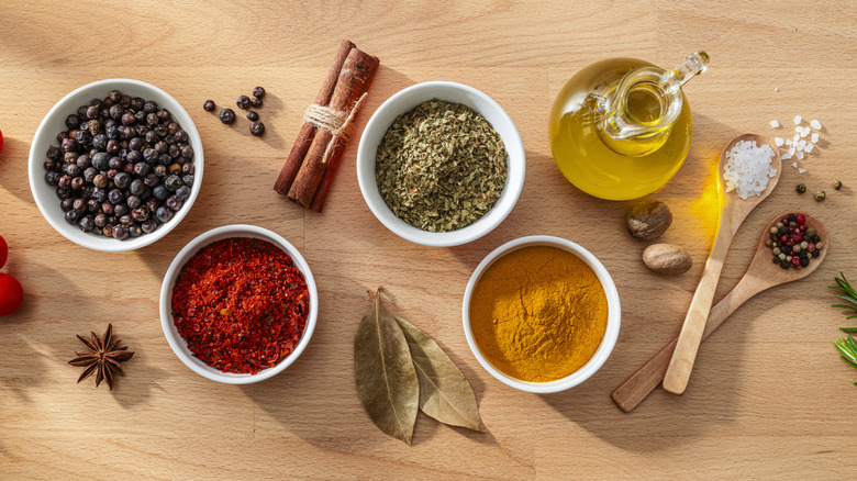 Various spices arranged together on a wooden surface