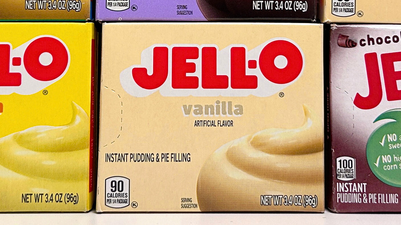 A close up of a box of Jell-O vanilla pudding mix arranged on a store shelf