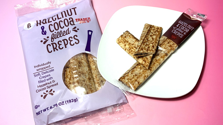 bag of packaged crepes next to plate with one wrapped crepe and one sliced in half