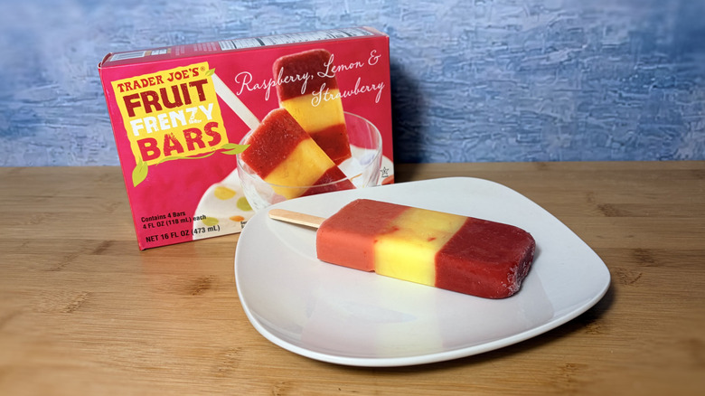 Popsicle on a plate with the package behind it