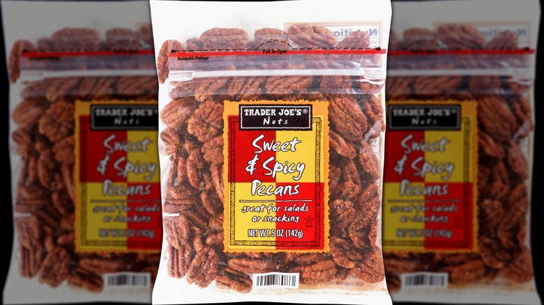 A bag of sweet and spicy pecans on a white background