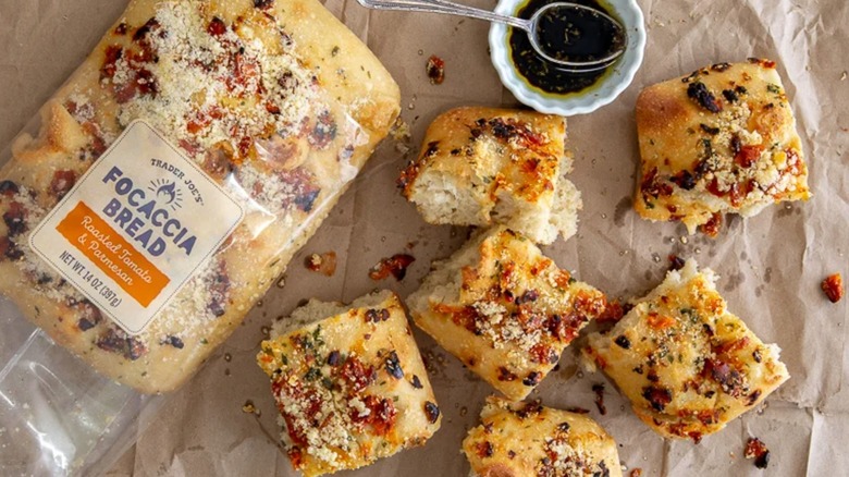 Package of Trader Joes Focaccia bread with roasted tomato and parmesan with pieces of bread