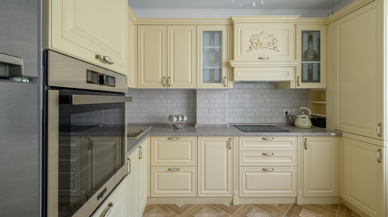 Modern kitchen with butter yellow cabinetry