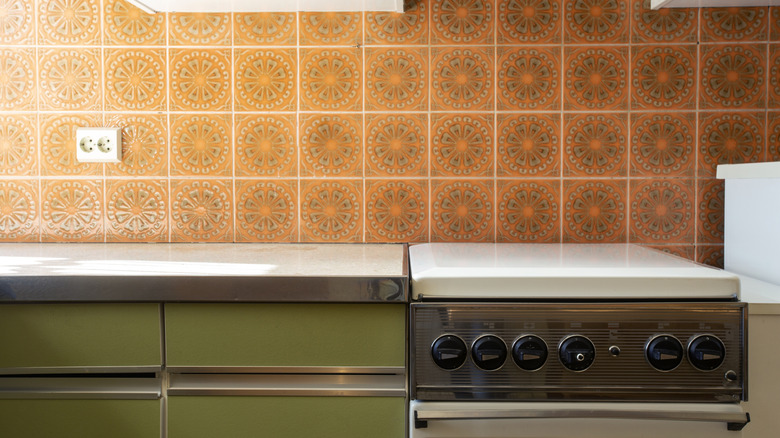 A pan of creamed spinach is cooked, with cream being poured into the pan