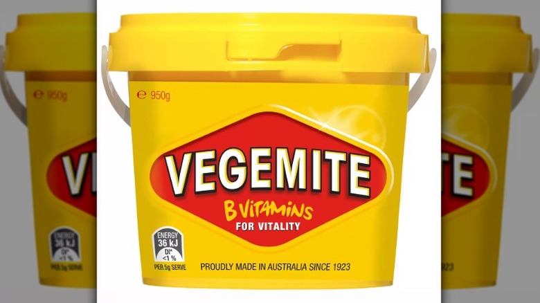 a bright yellow tub of Vegemite
