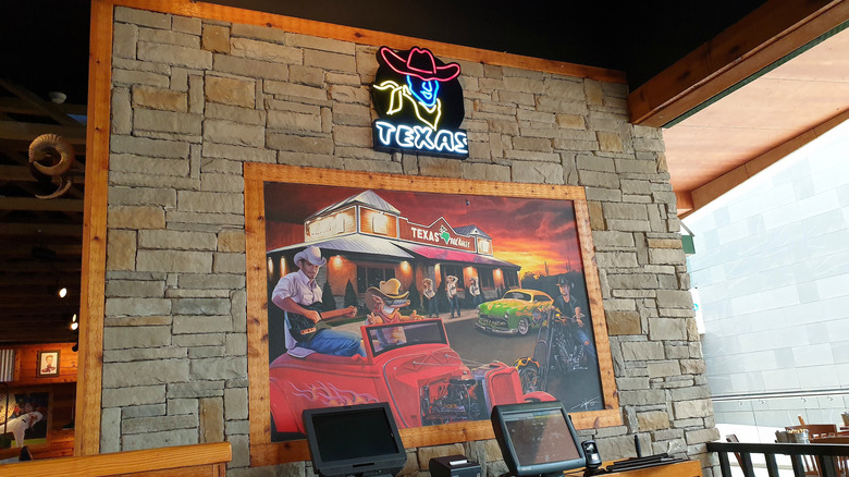 A mural on the wall of a Texas Roadhouse resturaunt