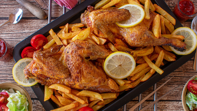 Chicken on top of fries