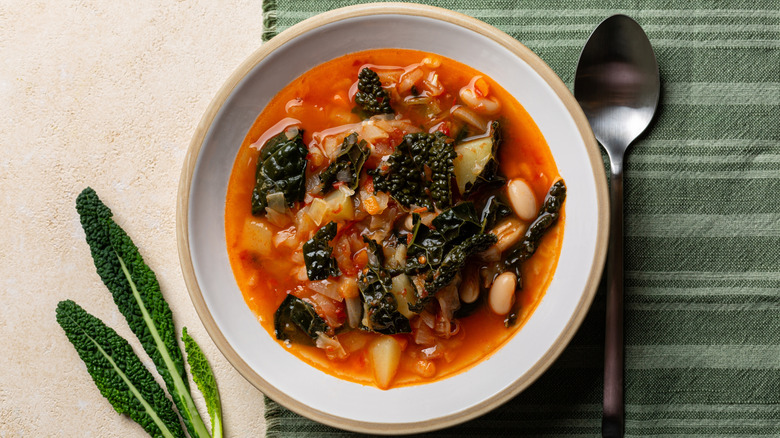 Tomato soup with kale and white beans
