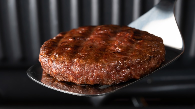 beef patty on spatula