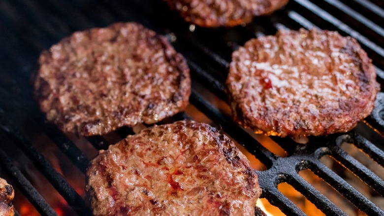 burger patties on grill