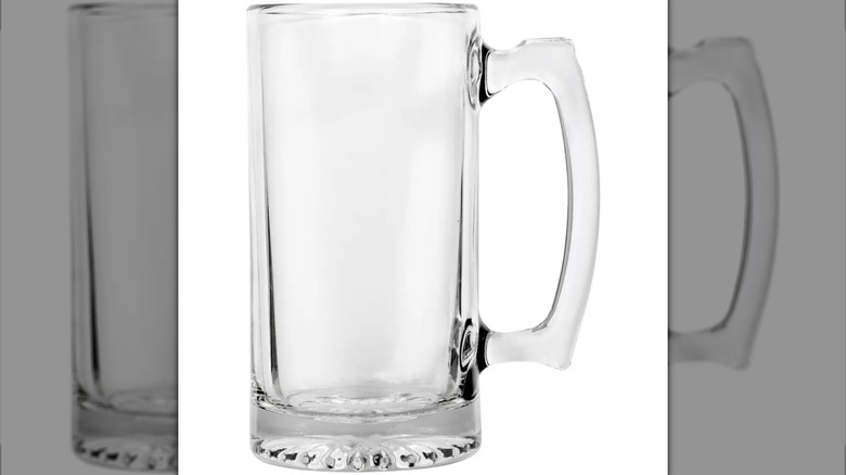 A tall clear glass mug