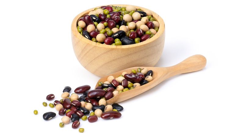 mixed dry beans in wooden bowl