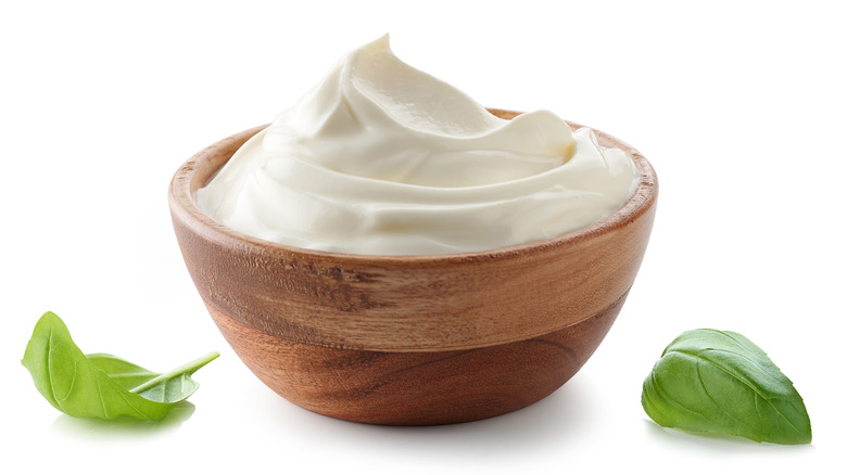 bowl of plain yogurt with mint leaves