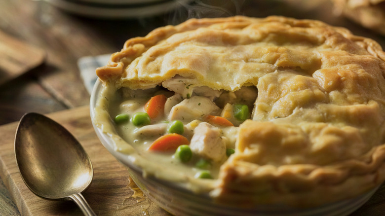 Close-up of a chicken pot pie posed on a cutting board