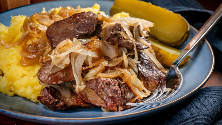 Close-up of liver and onions served on a plate