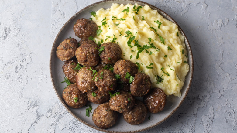 Overhead view of a plate of Swedish meatballs and mashed potatoes