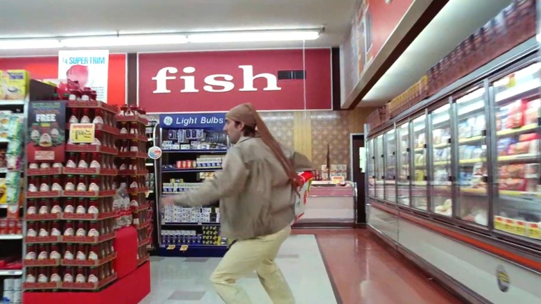 Nicholas Cage running in a grocery store in Raising Arizona