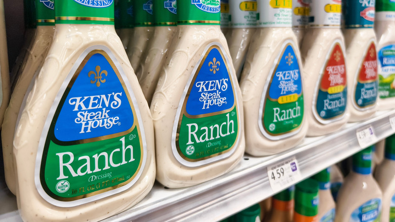 Close-up of Ken's Steakhouse Ranch dressing bottles lined up on grocery shelf