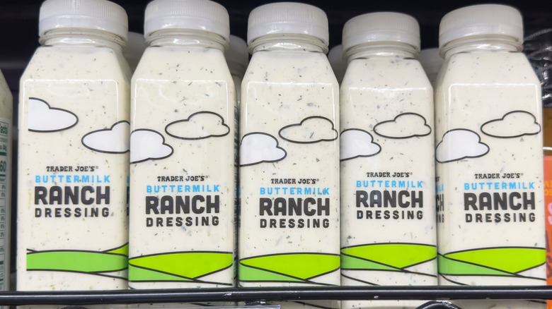 Trader Joe's Buttermilk Ranch Dressing bottles lined up in a row on a grocery store shelf