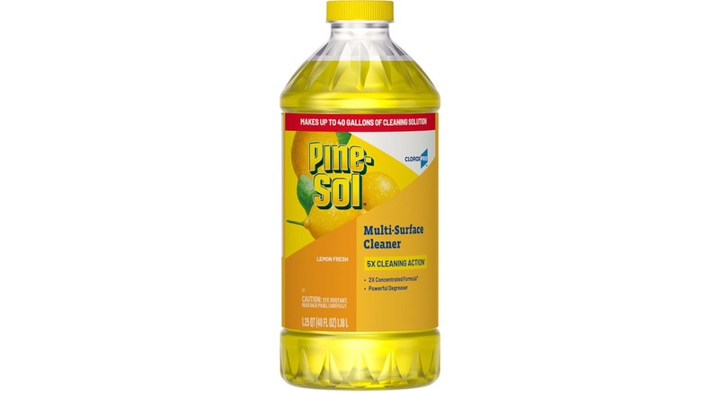 Bottle of lemon scented Pine-Sol Multi-Surface Cleaner with a yellow label and white background