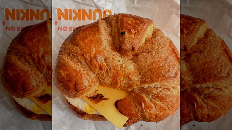 A Dunkin' egg and cheese croissant is seen from overhead