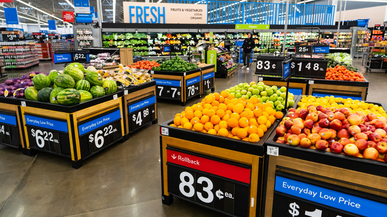 Walmart produce section, watermelons, oranges, apples, and lemons visible