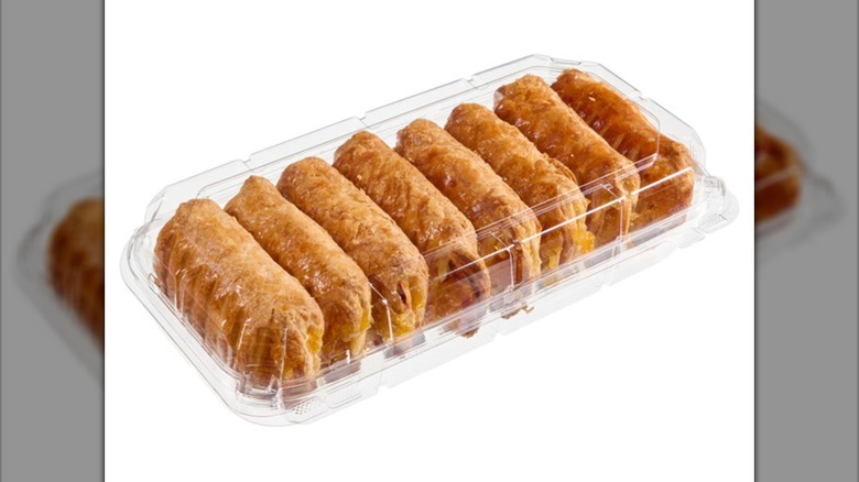 Clear plastic clamshell package with 8 peaches and cream pastries on their sides