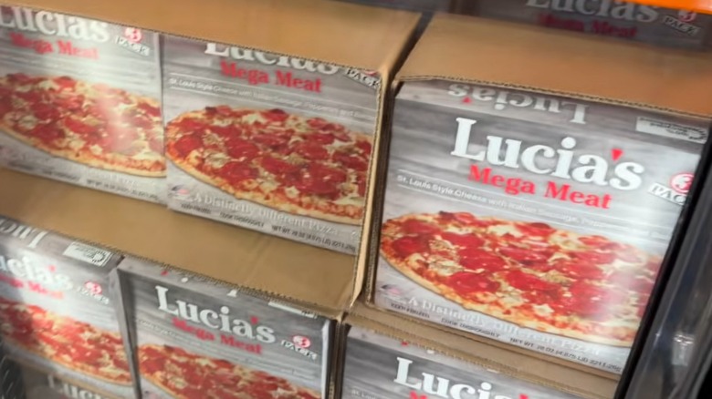 Gray boxes of Lucia's Mega Meat 3 pack in a Costco freezer
