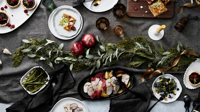Elegant holiday table with assorted savory and sweet dishes