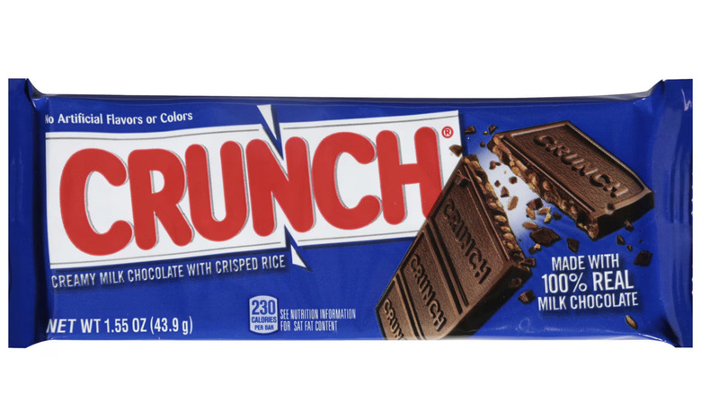 Crunch bar in navy blue package on white background