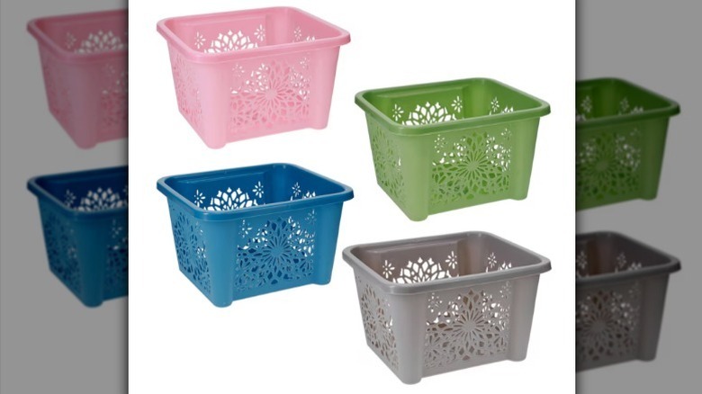Daisy printed plastic baskets on white background