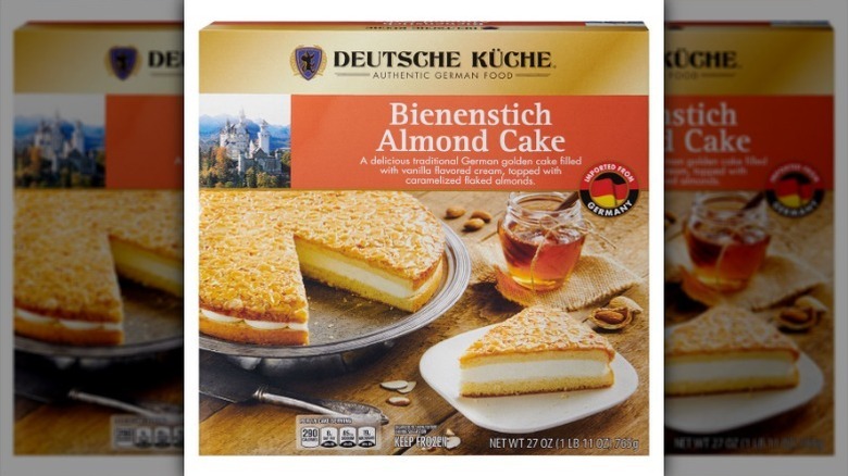 Box of almond cake on white background