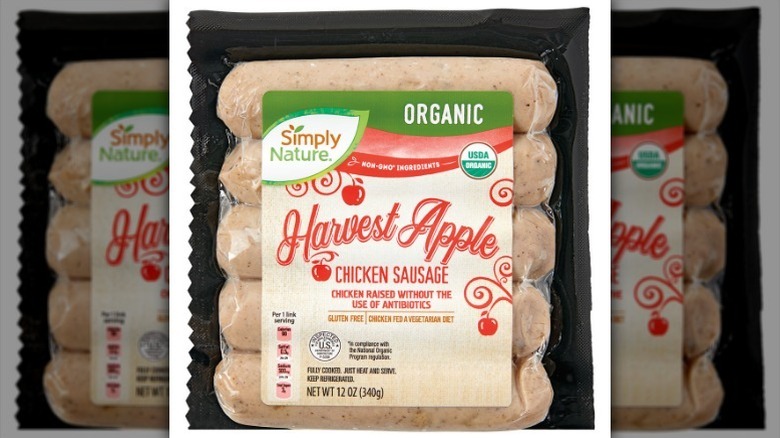 Package of apple chicken sausage on white background