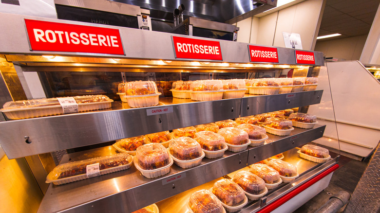 Rotisserie chickens under warming lamps at Sam's Club