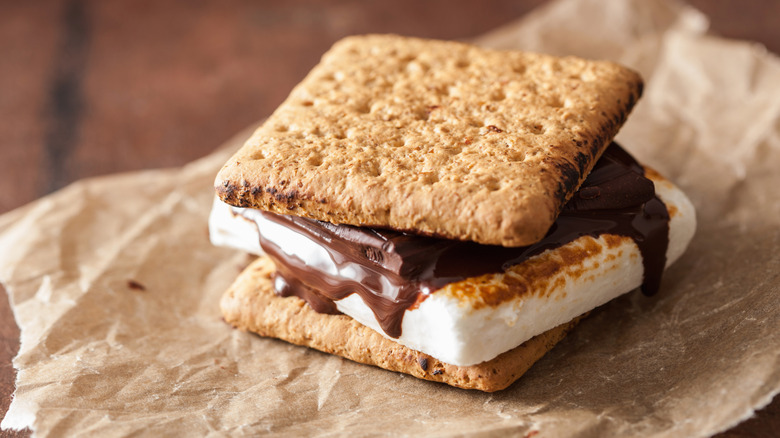 A s'more on a parchment paper placed on a table