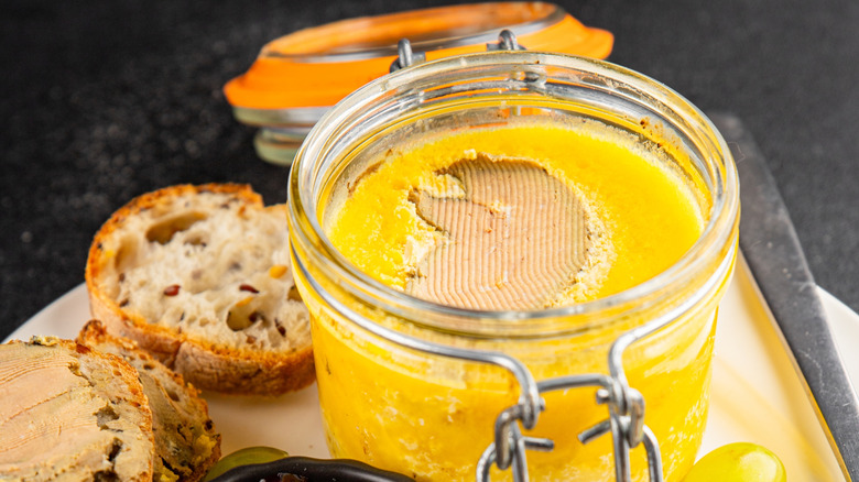 Close-up on jar of foie gras with bread