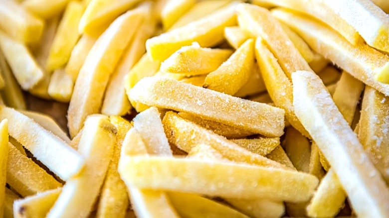 close up of frozen uncooked french fries