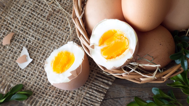 hard-boiled eggs beside basket