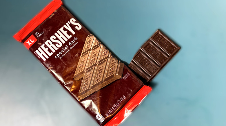 Piece of Hershey's special dark bar with packaged bar