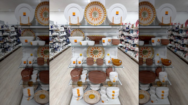 Harvest-themed and clay-colored dishware on display in HomeGoods