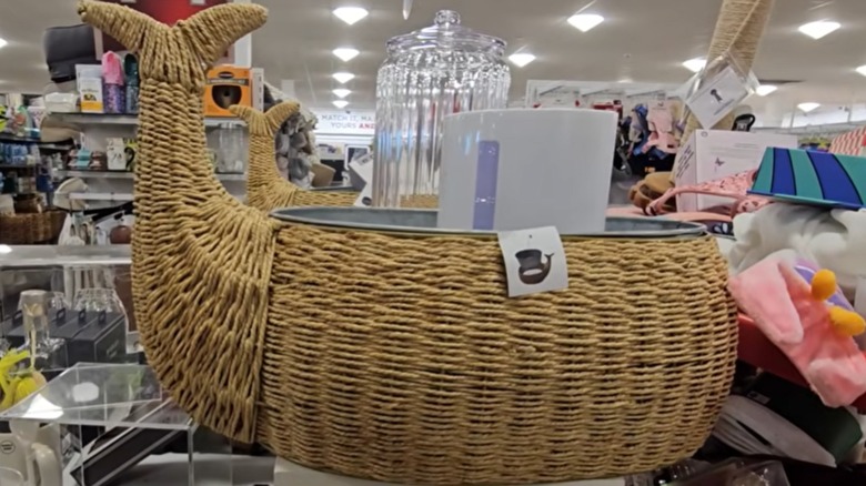 Wicker whale-shaped ice bucket at a HomeGoods store.