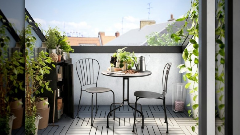 LACKO gray bistro table in outdoor courtyard