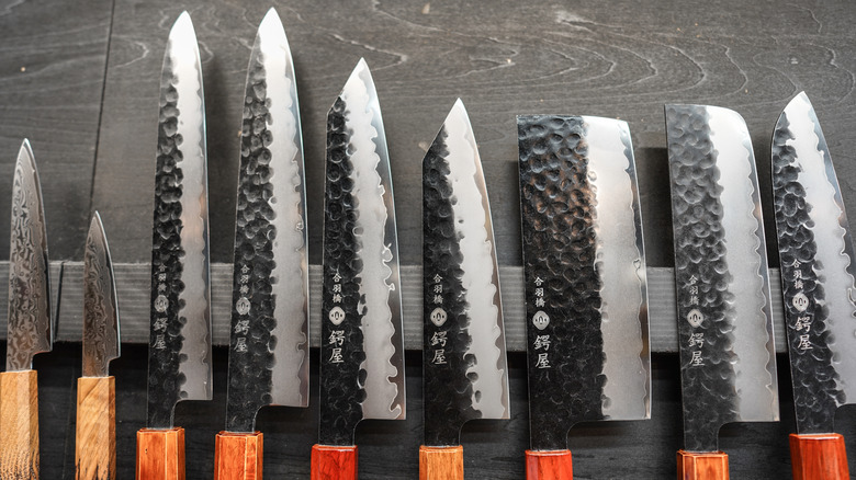 Variety of Japanese knives in the Damascus pattern at a shop in Tokyo