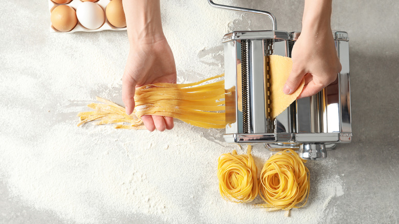 woman using pasta machine