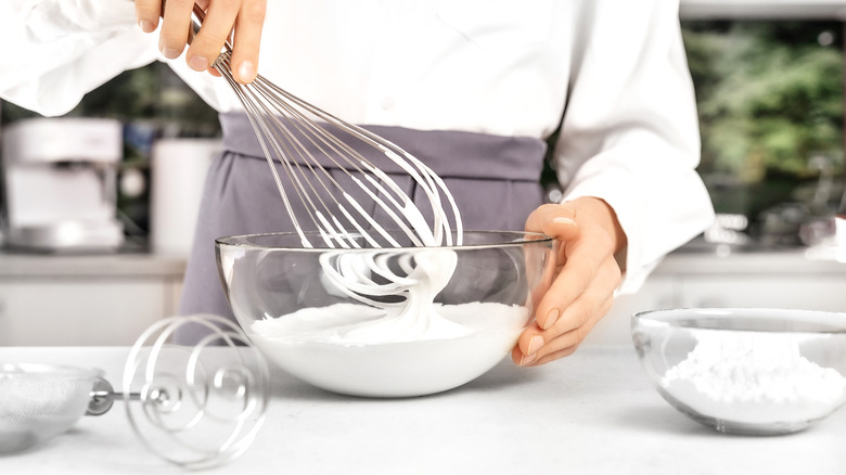 Person mixing soft whipped cream